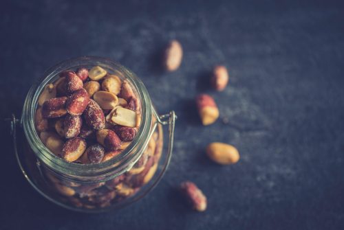 Heap of peanuts in the jar,selective focus and blank space
